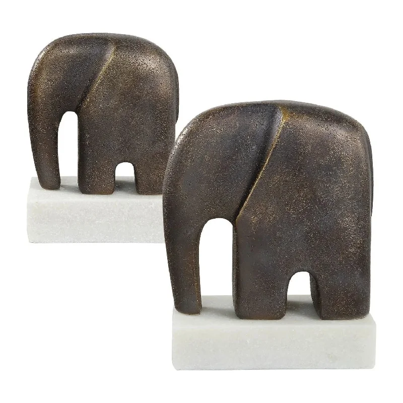 White track lighting for a clean lookTimeless Tusk Sculptures Set/2