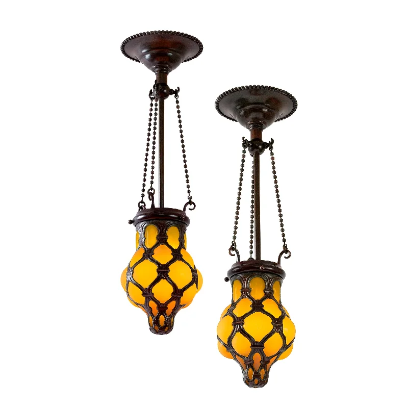 Chandeliers with Metal Frames in Bronze FinishChandeliers with Metal Frames in Bronze FinishPair of Tiffany Studios New York "Globe" Glass and Bronze Chandeliers Chandeliers with Metal Frames in Bronze FinishChandeliers with Metal Frames in Bronze FinishPair of Tiffany Studios New York "Globe" Glass and Bronze Chandeliers